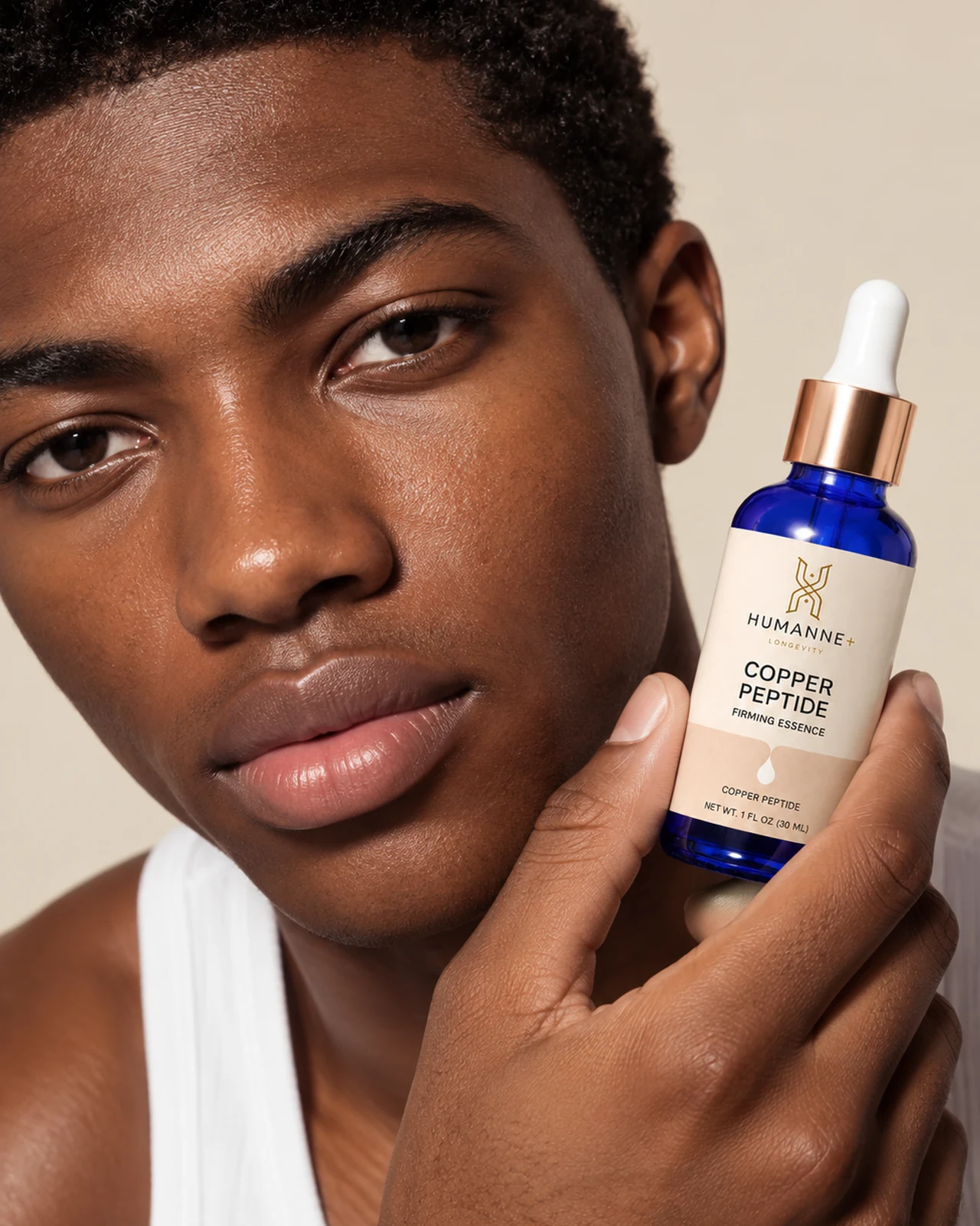 Man holding Copper Peptide Firming Essence